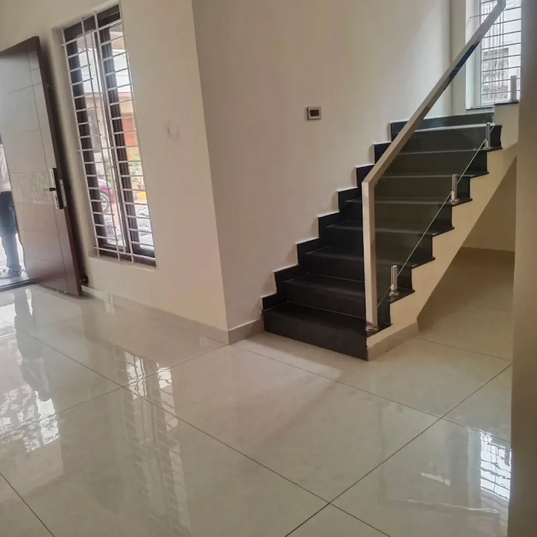 Freshly deep-cleaned home with polished floor and staircase
